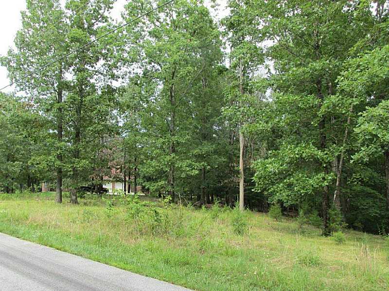 Conveniently located close to Rogers, golf course, and Beaver Lake. Large deep wooded lot with several building sites surrounded by custom homes.