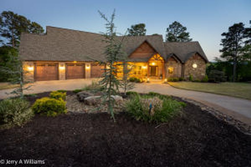 Executive excellence meets rustic mountain retreat, all in Russellville's finest neighborhood. Boasting of today's most wanted amenities while still keeping that cozy cabin feel. Sprawling over 7500+sqft, this home would make AV geeks envious with its control 4 technology & remote lighting/ security, full surround sound & so much more. Enjoy views of Mt Nebo while sipping coffee from your cozy breakfast nook then simply raise your custom Hunter Douglas blinds in the afternoons to enjoy some of the most beautiful sunsets while you dine. Finish off the evening with cocktails on the large deck under the stars. The Kosher rated Chef's kitchen was featured in ''At Home Arkansas'' magazine. Thermador appliances, leathered granite, warming drawers, and walkthrough pantry. Truly a paradise!