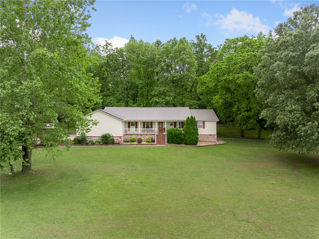 Come see this nicely updated 5-bedroom, 2.5-bath home on nearly an acre! With a spacious layout and modern touches throughout, this home is move-in ready and full of potential. You'll love the comfortable living spaces and generously sized bedrooms, perfect for everyday living. The fenced backyard offers a great spot for pets or outdoor fun, and the large lot gives you extra space and privacy to enjoy. It's a great mix of comfort, convenience, and room to spread out.