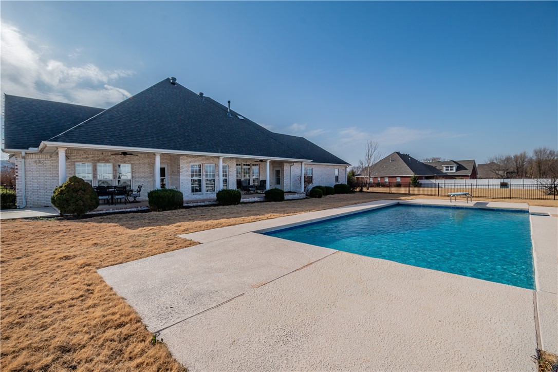 Set majestically on +/- 4.90 acres, this property offers a location that affords both serenity & convenience with remarkable views of the mountains & easy access to amenities & I-49. This newly updated 4,652 sq ft home boasts a spacious open floor-plan with updated eat-in Kitchen with bar, marble countertops, abundant cabinetry, under cabinet lighting & pantry open to a Living Room. Large ownerās suite with completely renovated bathroom including new vanity with marble countertop, floor to ceiling tile shower, jetted bathtub, light fixtures & dual closet w/built-ins. Additionally, main floor includes a Bedroom with full Bath, Dining Room & Living Room, Powder Bath & Utility Room with sink. Upstairs has 2 Bedrooms, a Bonus Room & Exercise/Office space with Full Bathroom. Enjoy the outside oasis with covered patio overlooking an in-ground pool & brand new 50x30 heated & insulated shop/barn with electric, water & gas, 3 12x12 stalls (can easily be taken out) & brand-new perimeter electric fencing. Farmington Schools