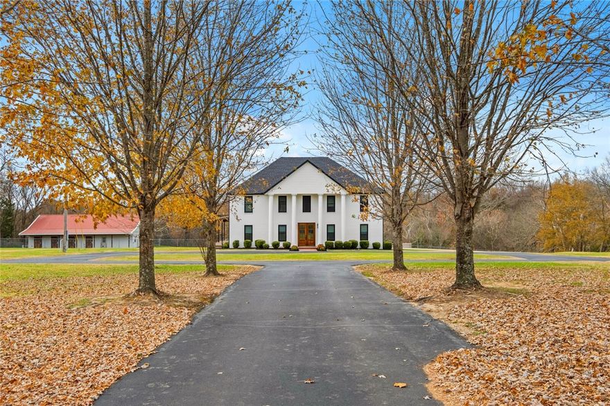 Beautifully updated estate property on two parcels with privacy, a long drive off Hwy 45, and walkable access to Mill Branch Park. Downstairs remodel completed 2017/2025; Skiles Architect designed pool deck/plaza remodel 2023. Covered composite deck and patio with cable railing overlook pool which was re-plastered (2024), new tile band (2024) and new pump (2025). New roof (2021), new windows (2021), composite front columns (2022). Library/study and mudroom (2024) with built-in mud lockers. Front barn exterior, windows, and glass garage door (2025). Property is equipped with an RV pad with hookups, tornado shelter, and three backup generators for house and barns. Both barns have full baths, central HVAC, vinyl plank floors, and separate septic systems; front barn includes full kitchen. There's an additional 32×30 shop and also shed/lien to. Fenced and cross-fenced property with wet-weather creek, Four 500 gallon propane tanks, and beautiful sunrise and sunset views.  See linked virtual tour for additional pictures.