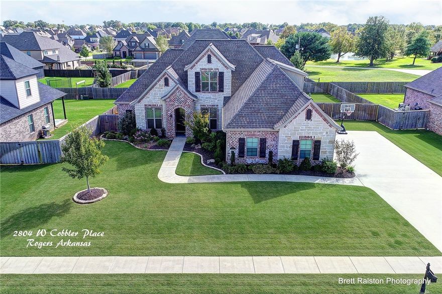 Elegant Family home in Silo Falls Subdivision, Landmarc custom built home with many extra amenities- 4 bedrooms, 3 1/2 baths, Bonus room, Formal dining, & office. Walk-in closets, Granite counters, hardwood flooring, dream kitchen w/ lots of custom cabinets that go up to the ceiling and stainless appliances, side load 3-car garage w/tornado shelter, large driveway for kids to play.  Wood Privacy fence in backyard. Covered back patio, quiet cul-de-sac street, neighborhood has community playground and pool.