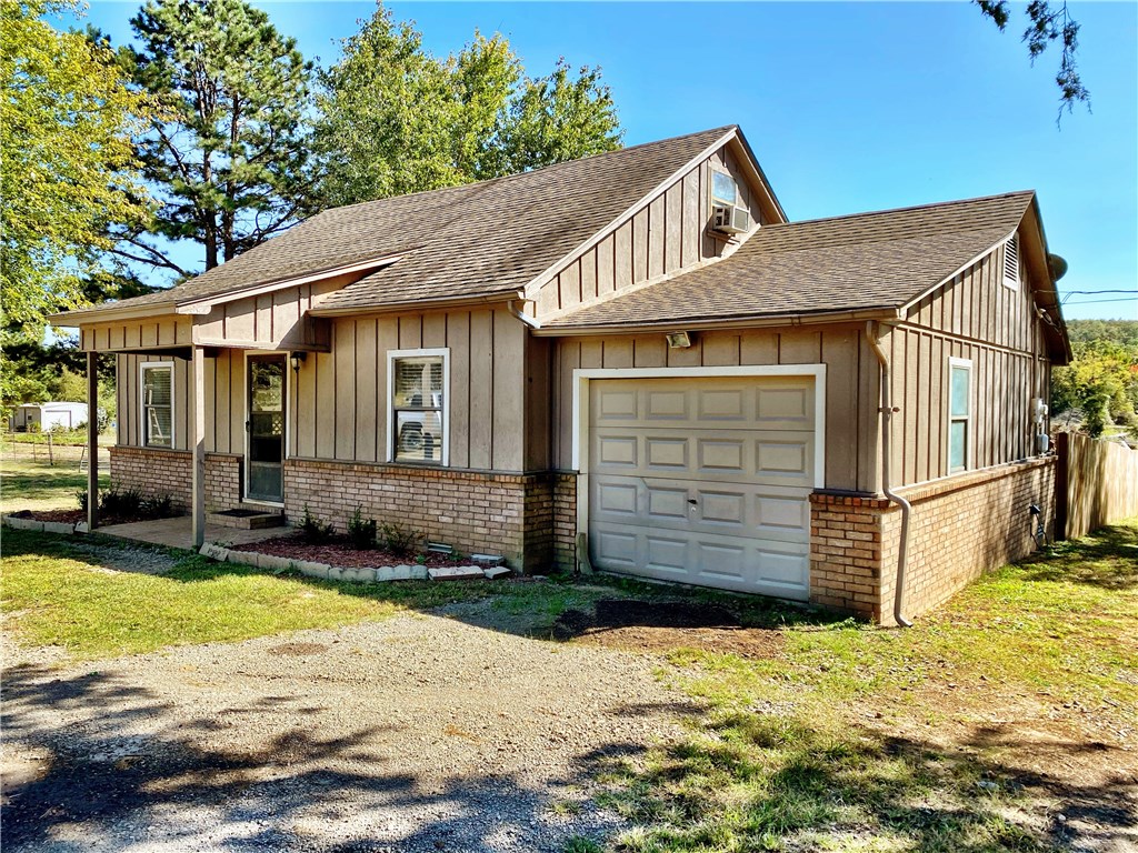 Come home to this quaint country home. If you are an outdoorsman, hunter or livestock owner this one is for you. Close to the conveniences of town but far enough to really spread out and relax. Great location sitting on 20 acres. Majority of first 10 acres is cleared with the back ten being timber and wooded. The land has a stocked pond and year round creek running through the middle of it. The home is a 2 bed 2 bath with oversized bonus room upstairs that could easily be a third bedroom. Wood burning stove in living room with carpet and laminate flooring. Large wood privacy fenced backyard. Home is turnkey livable but does need some tlc and updates. Great remodel project or live here while you build your dream home. Motivated seller, owner to provide a $3,000 dollar flooring allowance depending on offer. Vacant, combo lock box on door. Schedule your showing today.