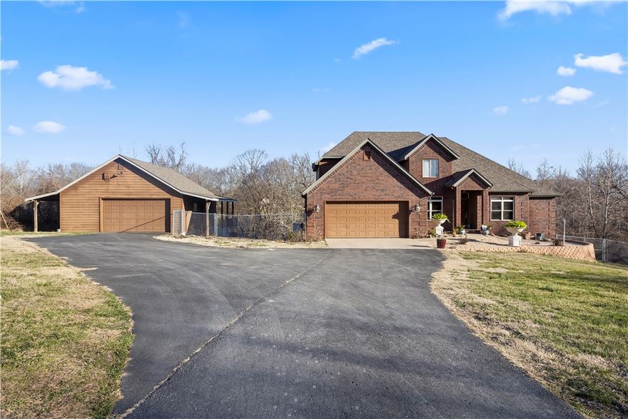 Farmhouse fresh on 2.5 Acres conveniently located just off of 72W, barely outside city limits. 

Discover the perfect blend of comfort and tranquility in this 5-bedroom/3.5-bathroom home, free from the constraints of covenants and HOA restrictions. Have your chickens, garden... whatever your heart desires! 

The house features a thoughtfully designed split floor plan spanning three levels, each level echoing the home's blend of sophistication and practicality. The spacious interior is matched by the property's extensive outdoor offerings, which includes a small orchard of fruit trees, promising delightful future harvests.

For the hobbyist, the property boasts an additional workshop, providing space for projects & storage plus the property includes a whole house generator! Don’t miss the surrounding security system! 

This property is not just a home but a lifestyle retreat! Located just 10 min from Walmart home office and Downtown Bentonville!