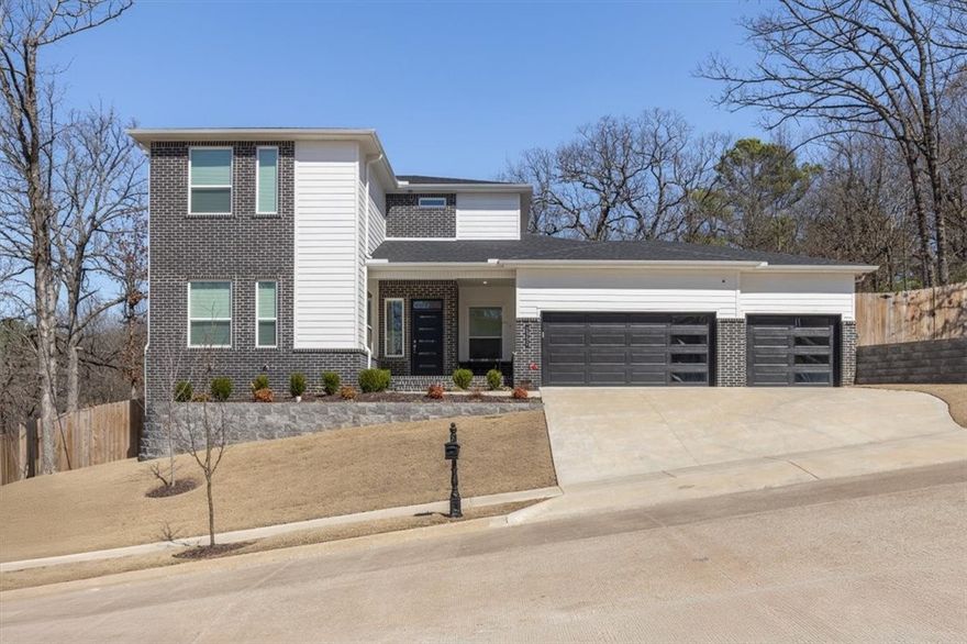 BACK ON THE MARKET DUE TO NO FAULT OF THE SELLER!! This 4-bed, 3-bath home is perfectly situated in the heart of Fayetteville, just minutes from everything you need! Designed with a sleek, modern aesthetic, the thoughtfully designed floor plan features LVP flooring, neutral tones, and an expansive living room with a gas log fireplace, stylish tile surround, and framed TV for a seamless, built-in look. The chef-inspired kitchen is both functional and striking, with stainless appliances, custom built-ins, a spacious island with seating, and a built-in mud bench with open shelving. The second level offers a large bonus room, two additional bedrooms, and a full bath, providing flexible space for a variety of needs. Step outside to enjoy the covered patio and spacious backyard, offering plenty of room for entertaining or relaxing. A home designed for modern style, comfort, and convenience—don’t miss out!