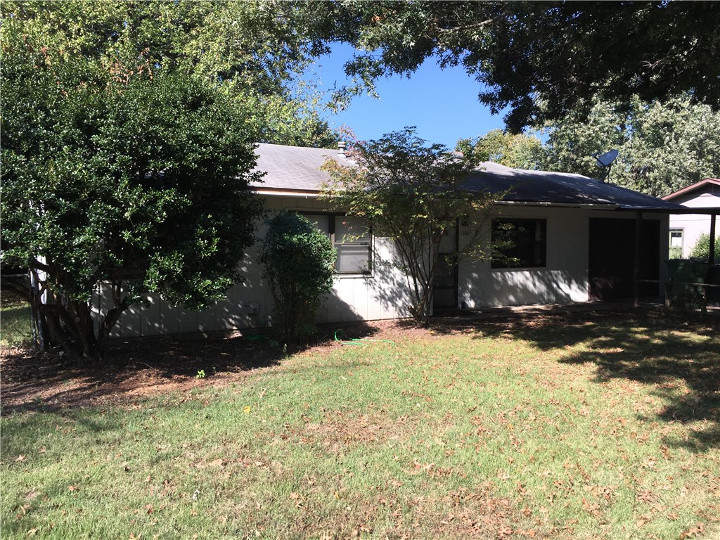 3 bed 2 bath with new vinyl plank flooring, big backyard, and large covered porch. Central Rogers location near schools and shopping.