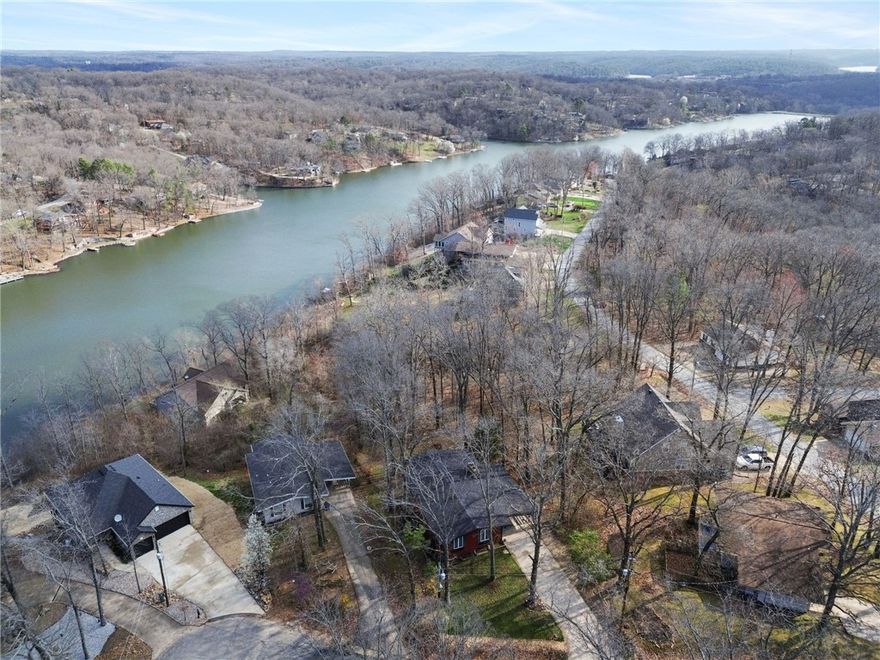 Enjoy beautiful lake views of Lake Avalon from this versatile 3-bedroom, 3-bath home tucked away on a private cul-de-sac in Bella Vista and located in the highly desirable Bentonville School District. The walk-out basement with a separate entrance offers excellent flexibility—perfect for guests, multi-generational living, or investment potential. Surrounded by nature yet close to everything, this home is just minutes from the Lake Avalon beach and provides quick access to the Lago Vista–West Mountain bike trail, making it ideal for outdoor enthusiasts. Whether you’re looking for your next home, a weekend retreat, or an investment opportunity, this property offers the perfect blend of privacy, location, and lifestyle. Come experience the best of Bella Vista living!