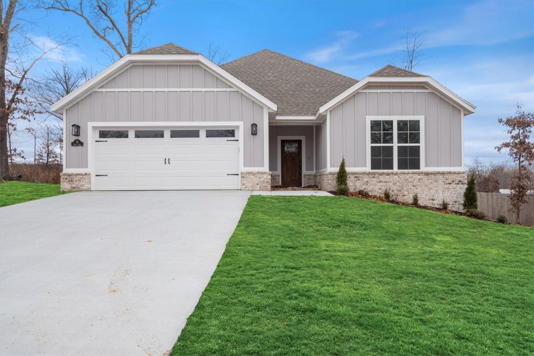 New construction close to Tunnel Vision trail! FLAT .43 acre lot. Very quick access to I-49. Includes LVP throughout, 3 cm granite counters, 10' ceiling in living, custom cabinets w/ wood hood, gas range, large walk-in pantry, & fireplace. Split floor plan. Primary bath includes a huge walk-in tile shower, double vanity, and generous closet space! Spacious covered patio and a backyard is ideal for entertaining. Bentonville schools! Approx completion date will be 6/1/2024. **Pics may not be of exact unit**