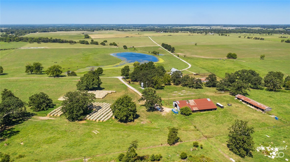 560 +/- acres located on prime location off of Highway 72 and West of Gravette. Stately working ranch with over 460 acres of pasture and 100+/- acres timber. Fabulous spring fed lake stocked with fish and year round spring fed creek running through the property. 1,576 sq ft house with 2 bedrooms, 2 full bathrooms and new HVAC. Property also offers an over 100 year barn with original wood and additional pole barns. The perfect setting to hunt and fish and the original site of Camp Walker Civil War site. All structures are sold as is.