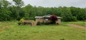 2 homes & a shop with gorgeous mountain, valley & city lake views! A 3 bedroom 2 bath 1120 s.f. brick with 700 s.f. decks, a 2 bedroom 1 bath, 896 s.f. guest house with wrap-around deck, and a 25x40 shop. The main house is currently being renovated, everything will be finished before closing. This property is being offered 3 different ways: 5 acres for $169,799, 6.67 acres for $178,799, or 11.67 acres for $199,799. This listing is a must see! Call us for your appointment today!