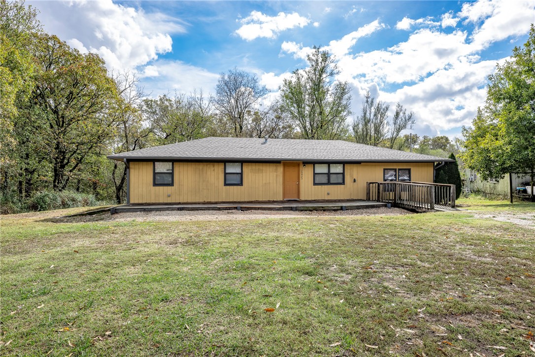 1.27 Acres...3 Bedroom 2 bath home with hardwood floors in living room, den/office/family room, hallway, all bedrooms. It has a great kitchen/dining combo with pass thru to living area. New roof in 2024, Furnace and A/C replaced in 2020, water heater replaced. Are you looking for a nice little home that sits on 1.27 acres with highway frontage? This is it!!