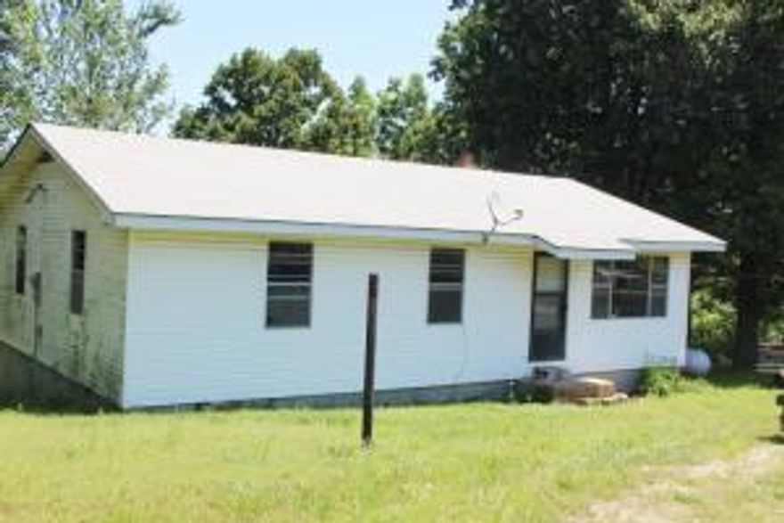 Country living on paved road with 13 acres m/l in Bergman School District. 3 BR 1 bath home with tons of potential! All #'s are approx., age is estimate, sq. footage per assessor, buyer to verify existence of septic.