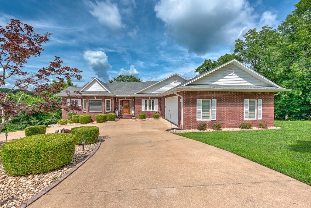 Peaceful, wooded setting overlooking former 12th fairway of Prairie Creek golf course, only minutes to Beaver Lake, this spacious 4-bed, 3-bath home offers the perfect blend of comfort, style, & fun. Enjoy breathtaking tree-lined views from two levels of expansive decks, ideal for morning coffee or evening gatherings. Inside, the home features a finished basement that's an entertainer’s dream—complete with a pool table, dart board, and bar. The master suite is a true retreat, featuring a private balcony. Updated features include new decks 2019, new roof 2021, HVAC’s 2017, hot water heater 2018.