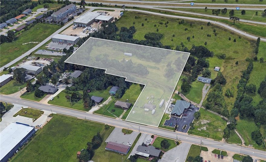 Fantastic Opportunity to own 6 +/- acres of commercial land (Zoned: C-5) on the busy I49 corridor of Springdale. This property fronts 330' of I-540 and also fronts 40th St. It can be used for big box retail, shopping center or hotels. The land dimensions are 330 x 1210 x 107 x 110 x 90. The land description is level, curbing, and cleared. There is cable on-site and it is near public transportation. Gas, and public water is on site. This area is growing extremely fast and this land is priced to sell!