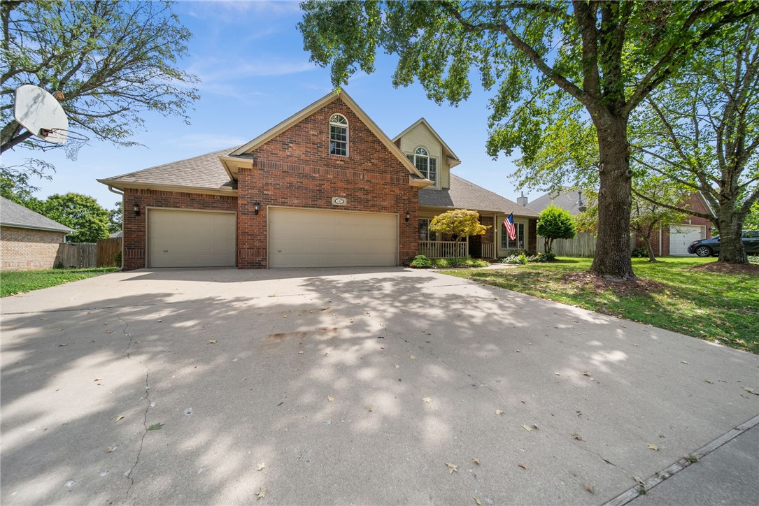 In the heart of Bentonville & nestled on a quiet tree-lined street, this 5 bedroom, 2.5 bath with 3 car oversized garage is calling your name. Just remodeled with designer finishes this one also boasts awesome curb appeal. Enter a spacious foyer & find a formal dining room with wood floors & lighting. Chef's kitchen is equipped with all new upgraded appliance package including a microwave, dishwasher & gas double oven (with air fryer). New quartz countertops, modern lighting, abundant cabinets, large breakfast bar, & pantry complete this kitchen. A remodeled half bath & utility room are steps from the kitchen. The open kitchen/living is ideal for entertaining & flooded with natural light. The re-imagined fireplace, coffered ceiling, wood flooring & paint show designer touches. The primary suite is on the main level with a completely remodeled bathroom including soaking tub, all new shower, toilet & quartz countertop.. Upstairs are 3 or 4 spacious bedrooms (one could be playroom) & freshly updated bath