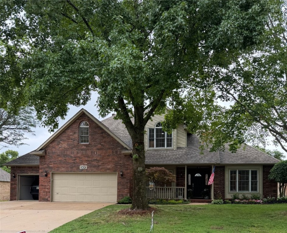 In the heart of Bentonville & nestled on a quiet tree-lined street, this 5 bedroom, 2.5 bath with 3 car oversized garage is calling your name. Just remodeled with designer finishes this one also boasts awesome curb appeal. Enter a spacious foyer & find a formal dining room with wood floors & lighting. Chef's kitchen is equipped with all new upgraded appliance package including a microwave, dishwasher & gas double oven (with air fryer). New quartz countertops, modern lighting, abundant cabinets, large breakfast bar, & pantry complete this kitchen. A remodeled half bath & utility room are steps from the kitchen. The open kitchen/living is ideal for entertaining & flooded with natural light. The re-imagined fireplace, coffered ceiling, all new flooring & paint show designer touches. The primary suite is on the main level with a completely remodeled bathroom including soaking tub, all new shower, toilet & quartz countertop.. Upstairs are 3 or 4 spacious bedrooms (one could be playroom) & freshly updated bath