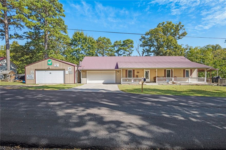 One of a kind seasonal lake view home including a total of 3 parcels with home and fully insulated shop! HVAC replaced just last year, new covered deck around three sides that are perfect for sitting and listening to the rain on the metal roof, converted basement space into additional sleeping or gathering area! This home is the perfect distance to downtown Roger’s mixed with an affordable lake lifestyle. Store your boat on site, finish out the shop to add additional living, or use it as a full or part time rental! Just south of the Hwy 12 bridge, this property offers unique lake access and a year round experience. This large lot offers inland cove living that feels like mountain living. Enjoy deer, bald eagles, fox, and all the wild birds Arkansas has to enjoy. Plenty of different areas to store whatever lake gear you may have and you can skip the cost of a slip/dock!