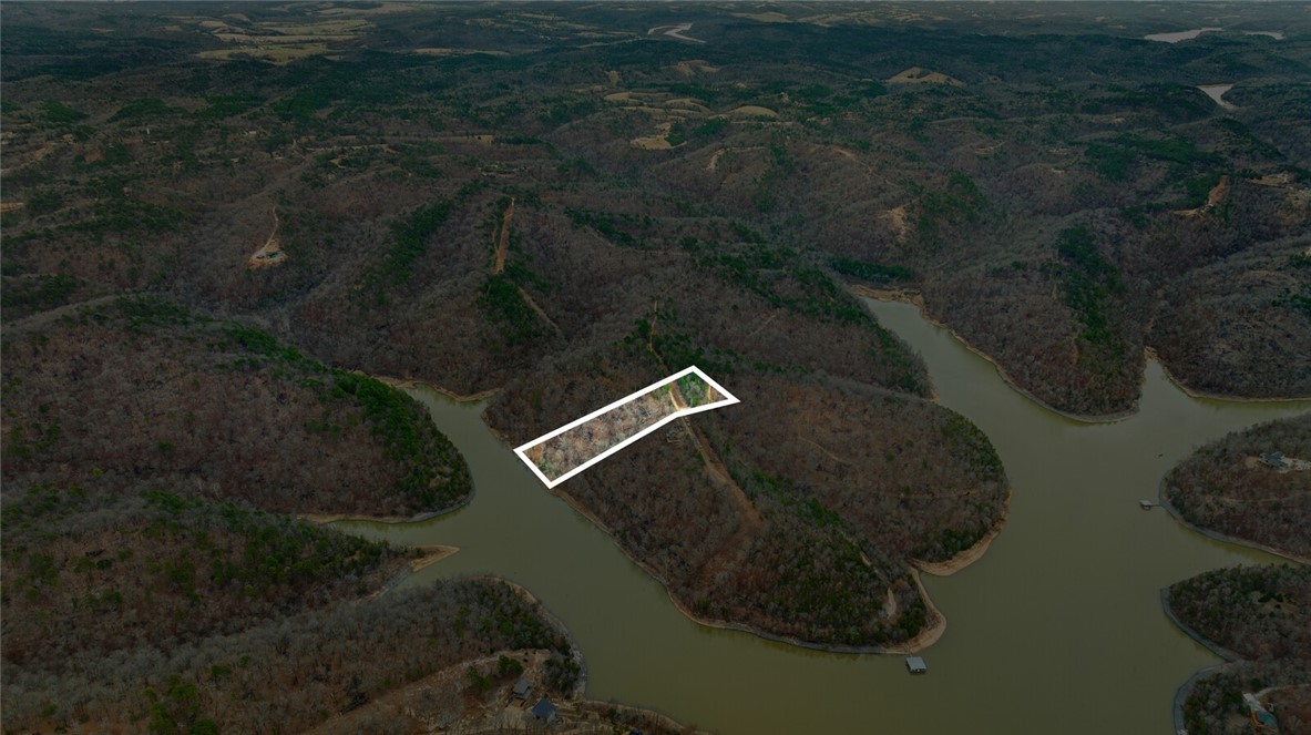 Discover the perfect canvas for your dream home with this stunning 5-acre tract in Emerald Bay subdivision. Boasting breathtaking views and endless potential, this property offers a serene retreat near the lake. While well water and septic are needed, electricity is already on-site, making your building process more convenient.
Located just minutes from the historic War Eagle Mill and a short drive to downtown Rogers, youāll enjoy the perfect balance of peaceful living and easy access to amenities. Whether youāre envisioning a custom home or a weekend getaway, this property provides the ideal setting to bring your vision to life. Donāt miss this rare opportunity to own a slice of Emerald Bay!