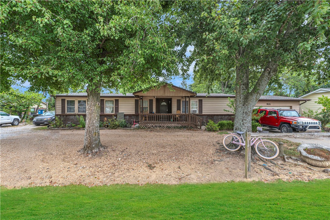 This charming 3-bedroom, 2-bath home sits on a spacious 0.63-acre lot in one of the most sought-after locations in Northwest Arkansas. Just minutes from Downtown Bentonville, Crystal Bridges Museum, The Momentary, and the Coler Mountain Bike Preserve, you'll be living at the crossroads of nature, culture, and convenience. Whether you're a first-time buyer, investor, or looking to downsize without giving up location, this property offers incredible potential. The seller is open to all offers and even willing to provide a credit for updates, making this a rare opportunity to personalize your space in a growing market. With top-rated schools nearby and easy access to Walmart HQ, NWACC, and local trails, 901 Watertower Rd is more than a home — it’s a lifestyle investment.