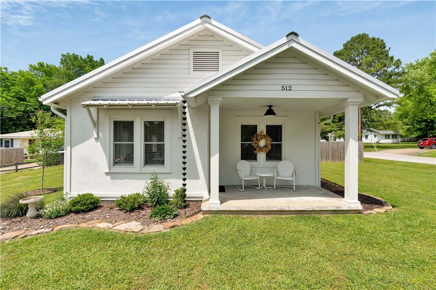 Completely restored 1946 home where modern comfort meets historic charm. This beautifully restored 1946 home blends timeless character with a full modern renovation completed in 2023. Every detail has been thoughtfully updated while preserving the craftmanship and warmth of the original build. Step inside to newly refinished original hardwood floors, custom lighting, and a bright, inviting layout. The kitchen features European-style appliances, a gas stove, and a one-of-a-kind custom countertop crafted from the home's original 1946 ceiling joist, a true conversation piece. Solid pine wainscoting in the kitchen and bath adds texture and authenticity. Major systems have been fully updated, including: New HVAC system and ductwork (2023), updated plumbing and electrical throughout, Maytag whole-house water filtration system, new Hardie board siding, gutters, downspouts, and French drains, complete interior and exterior repaint. The property also includes a large detached garage and workshop with hot and cold water.