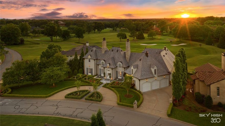 Located in Rogers’ prestigious Pinnacle Country Club, this palatial estate blends delicate French design with 21st-century amenities. Architectural elements, including a mansard DaVinci roof with copper guttering, evoke French Provincial style, with the three-story house even boasting formal French gardens with exquisite symmetry. The property features five en-suite bedrooms and grand reception rooms ideal for formal entertaining or intimate family gatherings. Custom detail is abundant throughout in the hand-carved cabinets, reclaimed hardwood floors, custom crystal chandeliers, cast stone fireplaces, high-end appliances and a safe room. Poised on the 17th green, the private grounds are further enhanced by a resort-style pool and poolside cabana surrounded by lush gardens. This estate brings the beauty of France to America’s South.