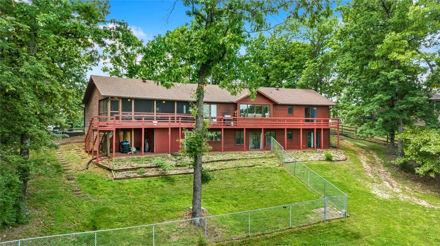 Welcome to lake living at 16048 Cypress Ln in Rogers! This beautiful 3-bed, 3.5-bath home sits on nearly an acre with peaceful Beaver Lake views. Enjoy main-level living, a finished walk-out basement, and a spacious deck and screened porch perfect for entertaining or relaxing. Features include granite countertops, stainless appliances, cathedral ceilings, and a double-sided fireplace. Surrounded by mature trees in a quiet lakeside community, this property offers privacy and convenience—just minutes from marinas, trails, and downtown Rogers.