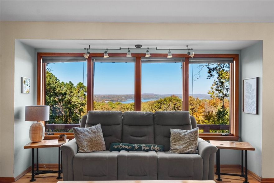 Welcome to lake living at 16048 Cypress Ln in Rogers! This beautiful 3-bed, 3.5-bath home sits on nearly an acre with peaceful Beaver Lake views. Enjoy main-level living, a finished walk-out basement, and a spacious deck and screened porch perfect for entertaining or relaxing. Features include granite countertops, stainless appliances, cathedral ceilings, and a double-sided fireplace. Surrounded by mature trees in a quiet lakeside community, this property offers privacy and convenience—just minutes from marinas, trails, and downtown Rogers.