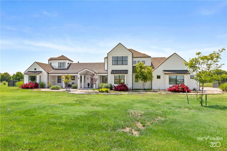 Immerse yourself in luxury in this remarkable custom home on 6.42 lush acres w/ private stocked pond. Open floor plan with lots of natural light and high end modern features. Huge living room with modern linear natural gas fireplace that opens to gorgeous kitchen with two of every high end appliance. Gameroom, office, two laundry rooms, mudroom, family room, storage rooms and all large bedrooms. Master features private patio & ensuite w/ steam spa shower. Whole house generator and water filtration system.