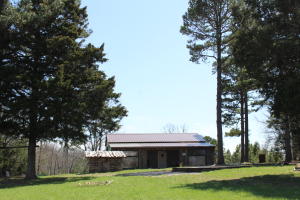 Perfect RV parking spot minutes to the Bull Shoals Lake. This 10.69 acre property has views, 20x30 garage/shed with 30' lean-to on both sides. Just over 1 mile off a paved road and has all utilities required to build your dream home or just use for your RV as a weekend get-a-way. Pine and hard woods surround the garage with a few acres cleared to make the possibilities limitless.