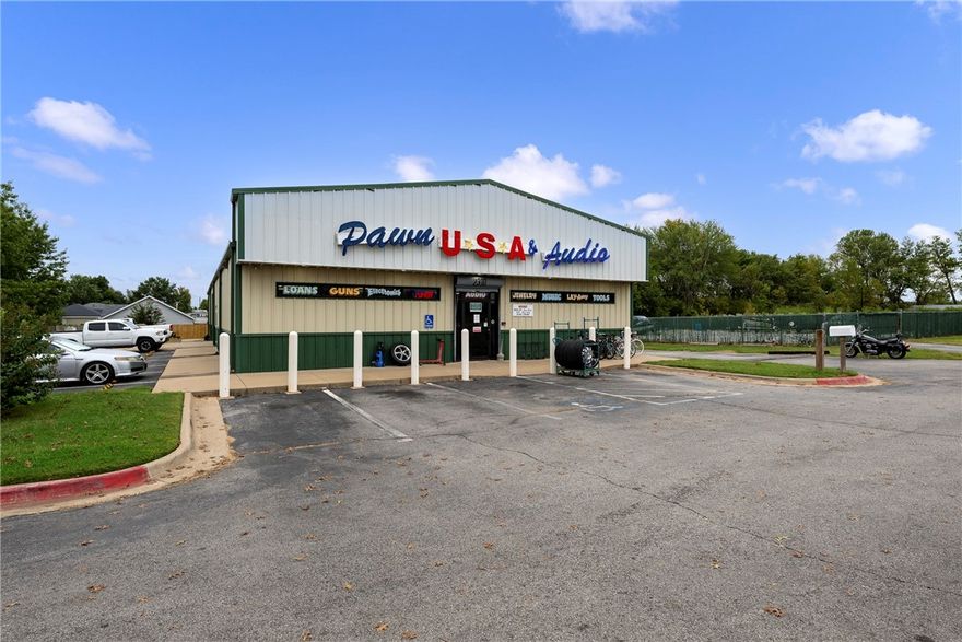 This prime commercial property is located on 1.48 +/- acres along SW 14th Street, one of Bentonville's busiest thoroughfares, with 237 feet of major road frontage and an impressive traffic count of approximately 35,000 vehicles per day. The property consists of two parcels: one featuring an insulated metal building with ample shop space, perfect for retail or business use, and a vacant lot offering limitless development potential. Situated less than a 10-minute drive from Downtown Bentonville, the Wal-Mart Home Office, and a Wal-Mart Supercenter, this location is ideal for businesses looking to capitalize on the city's rapid growth. Take advantage of this opportunity to become part of a thriving and expanding community. Roof original, HVAC replaced within last 5 years. Currently owner occupied. Owner and business will be vacating.