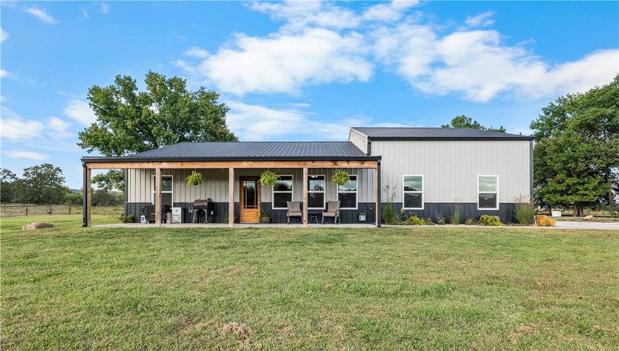 This stunning 26(+/-) acre property offers endless opportunities for peaceful rural living. Featuring an immaculate 1,400 sq ft home with 3 bedrooms and 2 bathrooms, this property is perfectly suited for those looking to embrace the homestead lifestyle, enjoy privacy, or establish a beautiful horse or hobby farm.  A long row of mature trees lines the driveway as you enter, creating a grand and welcoming approach to the property. Much of the perimeter is enclosed with durable steel pipe fencing — ideal for managing livestock and defining pasture or grazing areas. 10.5’ garage doors provide easy access for tractors, trailers, and equipment, and a multi-use shed on site can be adapted for small livestock, gardening, or additional storage.  Moores Creek runs along the rear of the property — a tranquil natural feature that enhances its beauty and functionality. Located approximately 25 minutes from Fayetteville, this property offers the perfect blend of rural seclusion and convenient access to town.