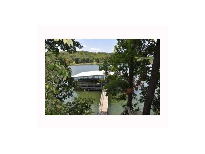 Short distance from Rogers to your lake property. From Sam's Club it is seveteen minute drive. Lots of trees to nestle your dream home among. A dock with two slips for the lake toys. Been waiting to purchase your lake property, wait no more.,High Meadows and Hickory Hills is the setting for this 11.87 acres! View of the Marina from the property.