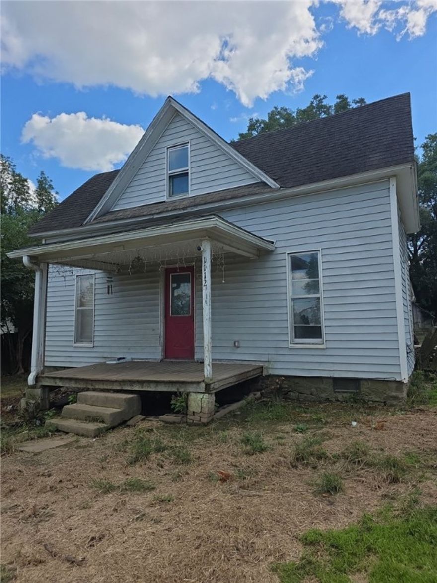 Looking for your next project? Here it is! In town and over a half acre (0.81acres) to remodel your heart's content. Deep lot, private, great location, so much potential must see to believe. Lots of charm in this cottage, high ceilings, simple floorplan, make it yours!