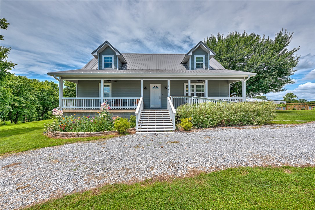Set on a beautifully landscaped lot surrounded by a lush variety of mature fruit treesāincluding apple, peach, and pawpawāthis enchanting home blends charm, comfort, and serenity. From the moment you arrive, the inviting front entry and lovingly maintained gardens, create a peaceful, welcoming tone. Inside, spacious living room flows effortlessly with an open layout. The large, light-filled kitchen is the heart of the home.Upstairs, a cozy media nook offers a restful place to unwind, while two oversized bedrooms provide peaceful retreats for family or guests. Step outside to a generous backyard with room to roam or let chickens wander. A versatile new detached garage offers endless potential. Just 4 miles from Bayyari Park & Mountain Bike Trails and 3.5 miles to Hickory Creek Park. Updates include new floors, paint, windows, water heater, and so much more! See the attachment! Come experience the peaceful charmāthis one truly feels like home.