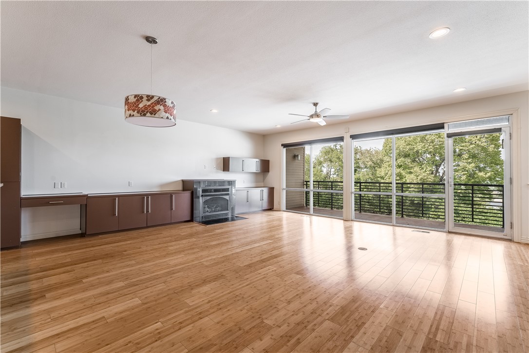 Open concept with floor to ceiling windows, granite countertops, stainless steel appliances, lvp and carpet throughout. Enjoy the spacious balconies and the fireplace located on the second floor. Great location near Rick's Bakery and multiple restaurants, bars and stores!