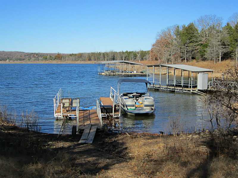 EASY OFF LAKE FRONT WITH BOAT DOCK !!!!! 3 BED ROOM 2 BATH/ OFFICE , OPEN FLOOR PLAN , DETACHED GARAGE . NEW HEAT PUMP & WATER PUMP. 500 GAL. RED GASOLINE TANK NEW. ALSO PONTOON BOAT & TRAILER FOR SALE .