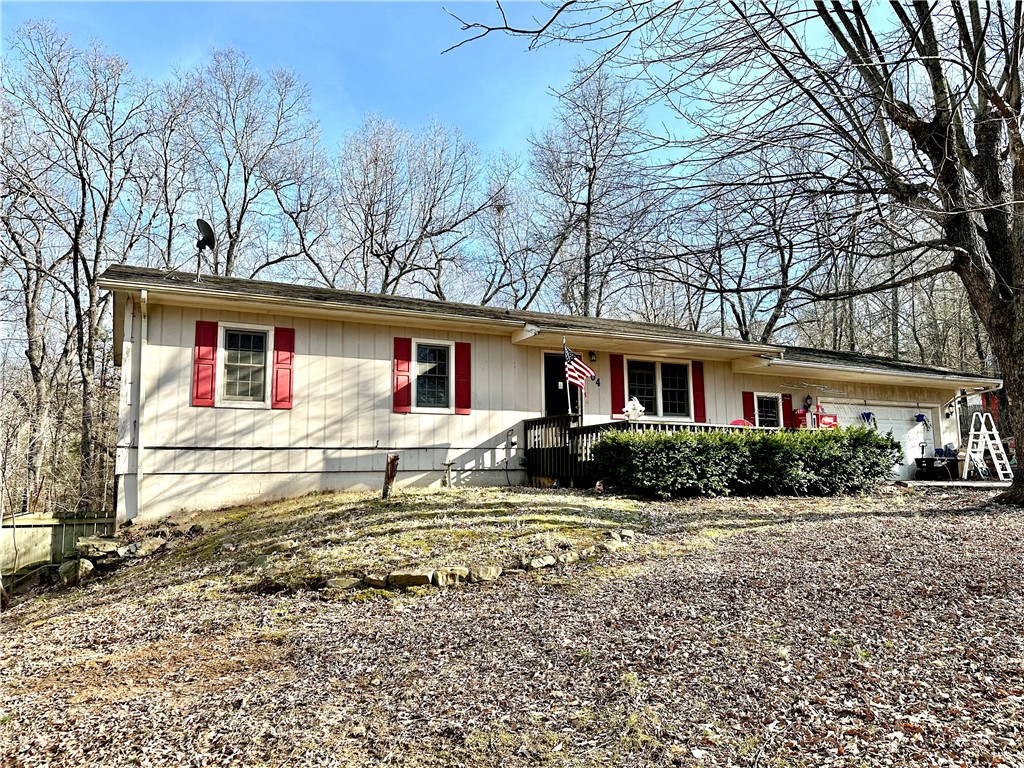 Ideal for a growing family, this 2112 sq ft home sits on over 1 acre across 4 lots adorned with mature trees. The upper level features a spacious kitchen, office, utility room, living room, and a master bedroom with a walk-in closet and full bathroom. Step out onto the large deck that overlooks the expansive yard.
The fully finished walkout basement adds versatility, with an additional utility hookup. Explore the potential to transform this level into a separate living quarters for extended family or generate rental income (House Hack). The basement includes two bedrooms, a full bathroom, and a large utility room that could easily become a kitchen/utility space.
Embrace the opportunity to build a workshop or capitalize on the extra lots. With an all-electric setup, this home provides a comfortable and efficient living environment. Seize the chance to create lasting memories in this fantastic family home with room to grow and endless possibilities!