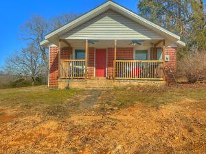Investor special! This 3-bedroom, 1-bath home sits on 7 acres, offering plenty of space and potential. The property features newer updates, including windows, roof, electrical, kitchen cabinets, and granite countertops, making it a solid foundation for your vision. A large laundry room adds convenience, while the surrounding acreage provides endless opportunities for expansion, gardening, or outdoor enjoyment. Bring your creativity and put your stamp on this fantastic property! Plus a outbuilding that makes a great shop! Home is being sold AS IS WHERE IS