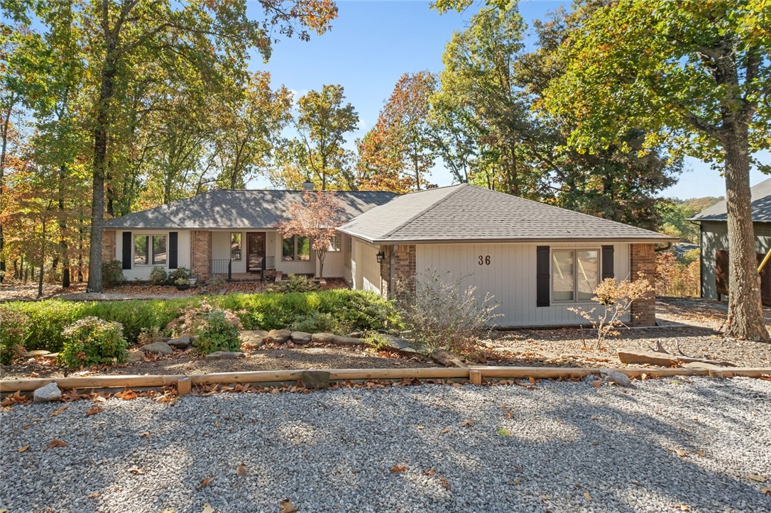 Cozy home with tons of character! This home is located in the heart of beautiful Bella Vista near biking trails, Lake Windsor, and even has a peek-a-boo winter lake view! This home is a 3 bed 2.5 bath home with a sunroom attached to the primary suite. Sun room has a mini split Hvac system for use year round that heats and cools the room. Sunroom is a passthru to the beautiful deck overlooking the winter lake view and the beautiful private nature of this .75 acre lot. Home comes partially furnished with 1 queen bed, washer/dryer and fridge as well as high end appliances and a gas stove top in the kitchen. Lease terms and length negotiable. 1 Small dog negotiable.