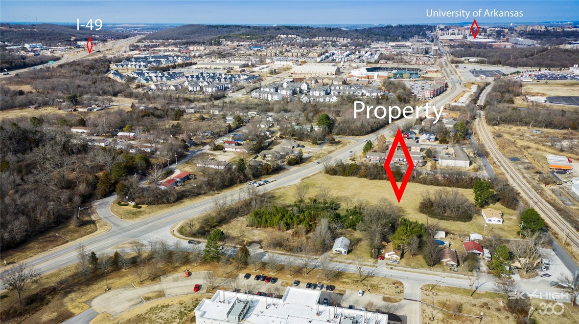Phenomenal location and zoning for this 3.5 acre MOL parcel. Zoned Community Services which allows by right up to 5 story structures, 18 ft minimum lot width. Existing Right of Way can connect Razorback Rd to Vale St. with approx. 500 ft width on each side of improved street. Located within the Opportunity Zone. This is one of the first properties traffic entering Fayetteville will see coming up from I-40 and getting off the Cato Springs exit to access the UofA campus. Would be a perfect location/site for a multifamily student housing development, a mixed use project, multiple cluster housing project, or a dense narrow/tall town home concept. Lots of options.