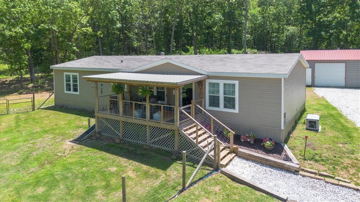 Discover the perfect blend of peace, privacy, and practicality with this charming 4-bedroom, 2-bath home nestled on 15 rolling acres. Whether youāre looking for a private retreat or space to expand, this property offers it all ā including 2 scenic ponds and a deck thatās ideal for quiet mornings or entertaining under the stars. Step inside to a bright, open living area filled with natural light and a well-appointed kitchen with generous storage and workspace. The split bedroom layout offers a private primary suite, while the additional bedrooms are perfect for guests, a home office, or hobby space. Thoughtful upgrades include a circular vent system, whole-house surge protector, dependable Stratton propane generator, and dual water spigots for outdoor convenience. The large carport easily accommodates a tractor and trailer, and a second homesite is ready ā ideal for multi-generational living or future development. If youāve been searching for a serene setting with room to roam, this countryside gem is calling.