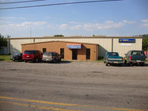 GREAT LOCATION FOR ANYTHING PERTAINING TO A TRUCKING BUSINESS, A TIRE BUSINESS OR MANY OTHER SERVICE TYPE BUSINESSES. CURRENTLY IS LEASED TO OZARKO TIRE CO. INCLUDES 5.14 ACRES. ONLY $399,000. MLS#14-1788.
