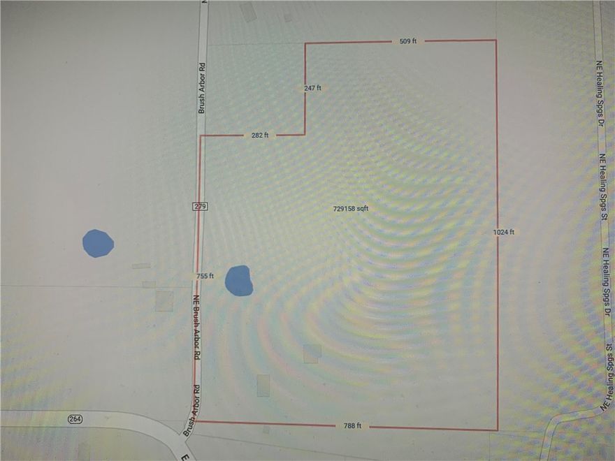 Excellent property with 797 feet of frontage on Brush Arbor Rd and touches Hwy 264. Has a 1520 sq ft brick house 3 BDR 2 Bath that has been rented to same client for about 10 years but sells in As is Condition value placed on the land. Property touches Healing Springs Subdivision on east side.