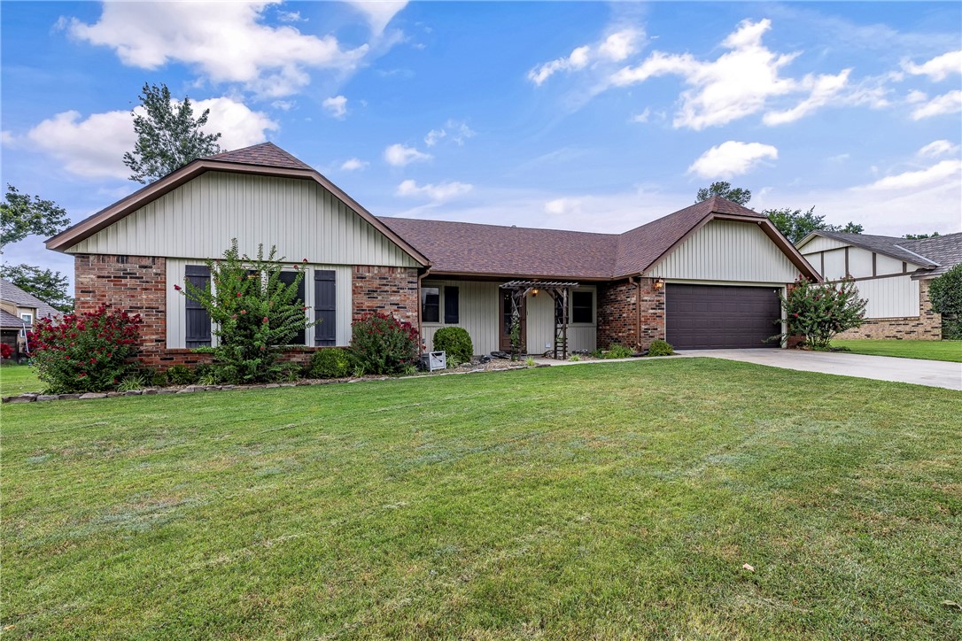 This inviting 1,878 sqft home offers 3 bedrooms, 2 bathrooms, & sits on a spacious 0.28-acre lot w/ great curb appeal, highlighted by landscaped flower beds that give a warm first impression. Inside, youāll find character & charm throughout. The living room features a beautiful, beamed ceiling, cozy gas bricked fireplace, & wood floors that create a welcoming atmosphere. A formal dining room provides the perfect setting for gatherings, while the sunroom, complete w/ skylights, brings in natural light year-round. Recent updates include fresh interior paint, new carpet, a new garage door opener, new sliding patio door, new fence & newer appliances. The backyard is a true standout. Along w/ plenty of space for gardening or outdoor enjoyment, youāll love the large detached workshop w/ roll-up door & 220-volt outlet, ideal for hobbies, or additional storage. Unbeatable location Just minutes from the Rogers entertainment district, I-49 access, schools, & paved bike trails, it offers both convenience & lifestyle.