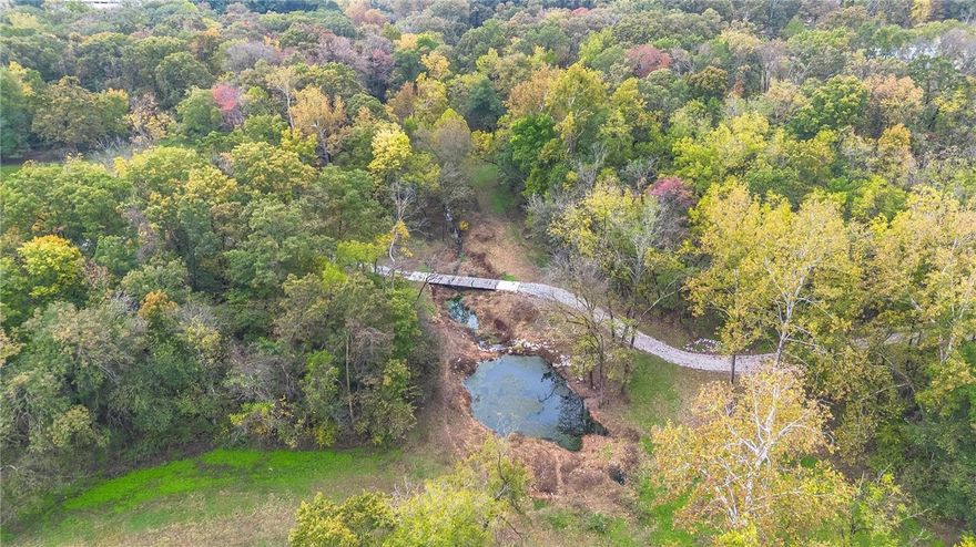 Discover 30 stunning acres just minutes off pavement and close to the interstate—perfectly blending convenience and country living. About half the property features beautifully groomed open acreage, ideal for building, grazing, or recreation. The remainder is a mix of mature timber and a picturesque valley with a year-round creek meandering through, creating a serene natural retreat. Pipe fencing lines the property, offering both security and charm. With multiple prime home sites scattered throughout, this land is ready for your dream estate, hobby farm, or weekend getaway. A rare find combining open pasture, timber, and water in one exceptional setting!