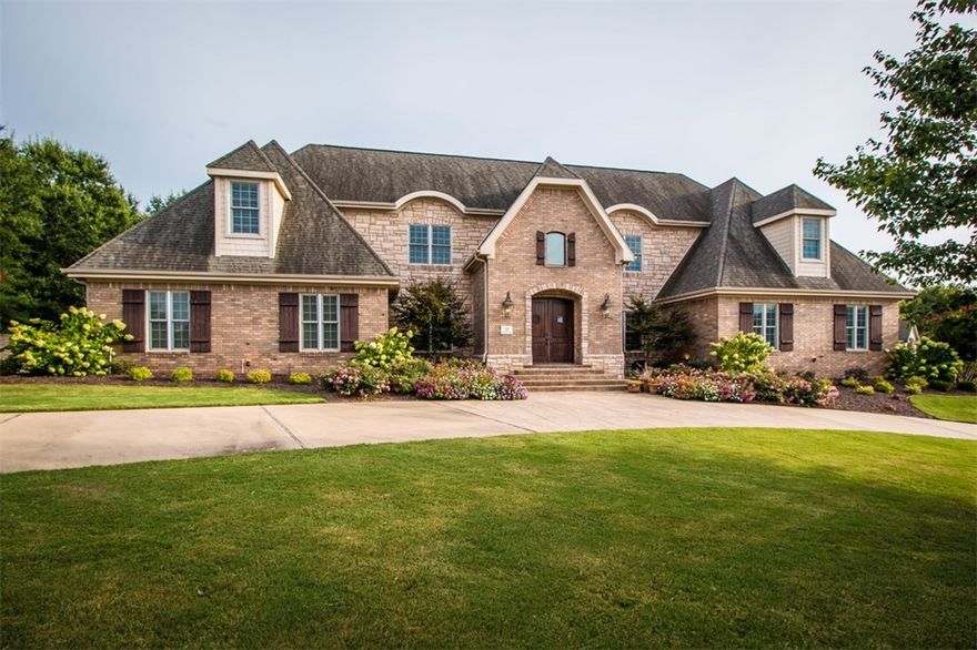 Ideal for entertaining inside & out. This spectacular 5 BR, 3.5 bath home on 0.79 acre in prestigious gated Pinnacle Country Club is a Buyer's dream. Featuring soaring staircase & ceilings, custom lighting, study, 2 bonus rooms, spacious master suite w/large walk-in closet & separate cedar closet.  Updated gourmet kitchen w/granite, double ovens, gas cook top, warming drawer & wine refrigerator. Backyard oasis complete w/heated gunite pool, fountain & hot tub, lush landscaping & brand new poolside cabana & outdoor kitchen.