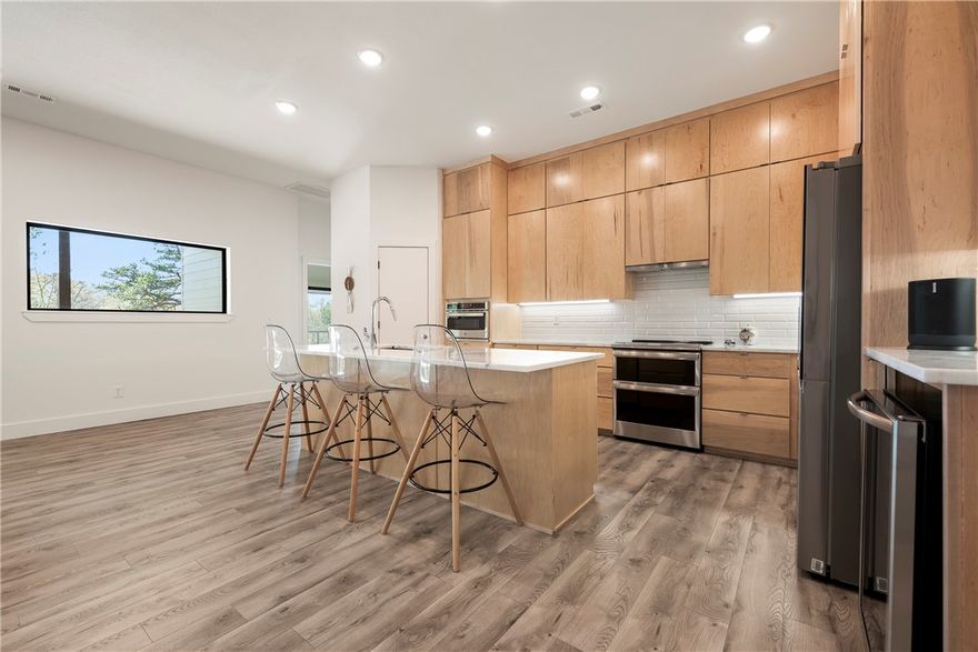 Full mother-in-law quarters. This unique 4357sq. ft home has 2612sq..ft. upstairs and 1745 downstairs. Located in a wooded cul-de-sac, the house offers privacy with beautiful views of the woods and the sound of a distant creek from the stunning double size wrap around covered deck. Modern high quality laminate flooring throughout. The main level has 3 BRs and 3 1/2 baths. Beautiful maple kitchen cabinets and center island with marble countertops highlight the open floor plan. New 5-star premium appliances all convey with home. The master bath has a large walk-in shower, a soaker tub, and a cedar sauna. Two baths plus a large, shared walk-in shower serve the secondary BRs. The lower level features a full kitchen, large living/entertaining area overlooking an outdoor sitting area, plus 3 BRs 2 baths. It has a closed stairwell to the upper floor, a deck, and an outside entry as well- perfect for an in-law suite. EV outlet in garage. So many features in this home that you will not want to miss this one at this price.