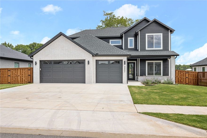 This stunning, move in ready home has an amazing layout & located in a highly sought after Scissortail community. 4 bedrooms plus a bonus room, 3 car garage, private/fenced backyard, open living, and more! Vaulted ceilings breathe plenty of natural light and airy space into the home. The living room has a beautiful fireplace feature and has access to the eat in kitchen and outdoor living, great for entertaining! The kitchen is the heart of the home, featuring a large island with counter seating, a great sized dining area, gas range with pot-filler, double ovens, and huge pantry! Guest bedroom and bath on main level. The primary has a stunning feature wall and spa-like attached bath with soaking tub, luxurious shower, and large WIC. Upstairs are two guest rooms, each w/private attached baths & large closets. Bonus room upstairs is a perfect media, game, or playroom! Enjoy being minutes away from Uptown Rogers shopping, dining, and entertainment all from this amazing, gated community with amenities!