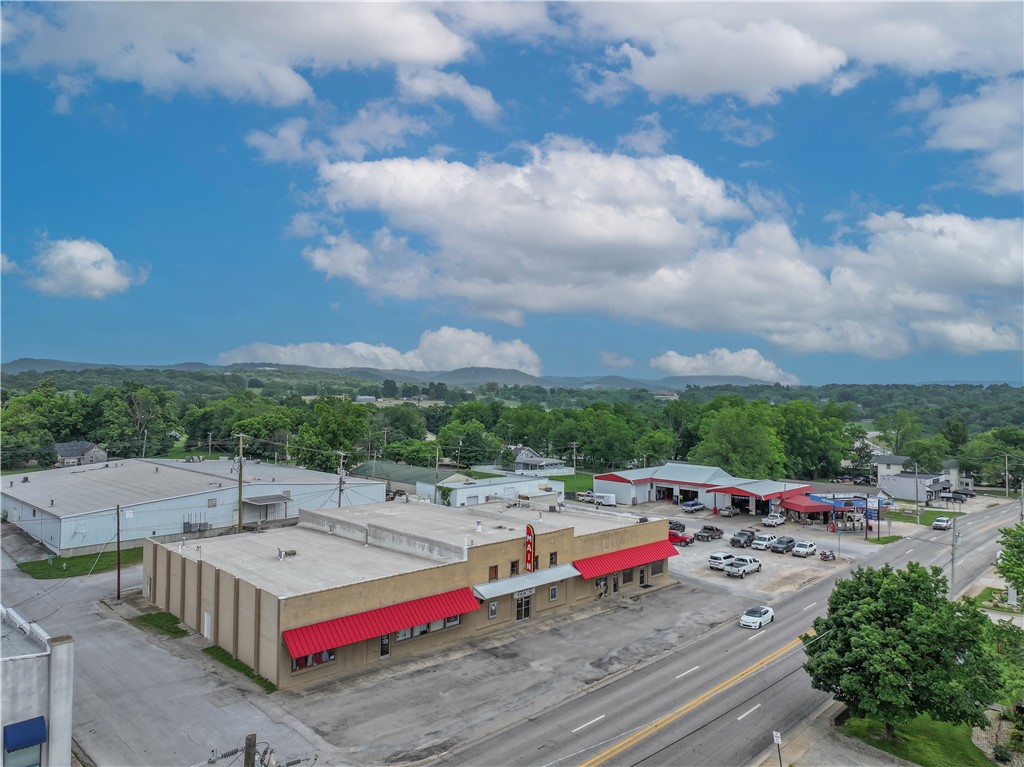 Investment Opportunity! this 16,000 plus sq. ft. building houses well established 150 seat movie theater and a complete restaurant, also many rental spaces for offices, and retail spaces. The movie theater is well established and has provided entertainment for many years. Some of the spaces are currently rented by renters that have been there for many years and some newer renters. This property has been family owned and operated since 1974. The Theater was started in the late 1940's. The whole building is a piece of history. Property also has large parking lot which is partially rented. Seller asks all showings set between 8 and 11 AM. Property has a current termite policy as of December 2024