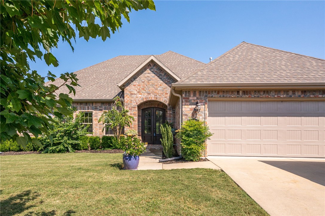 Immaculate home with a breathtaking golf view! Spacious 2402 Sf open floor plan with split 3 BR/2 BA. Elegant entryway, private study, living room features cathedral ceiling with beautiful wood beams, hardwood floors and a lovely floor to ceiling stone fireplace with built-ins on either side. Kitchen features granite countertops, under cabinet lighting, SS appliances and the bar is open to the living room. Cozy master bedroom and a roomy master bath with separate vanities, large separate shower and tub. Hardwood floors throughout, 1200 SF of beautiful Slate stone flooring and plantation shutters. Amazing landscape, large covered patio with can lighting and iron fencing.